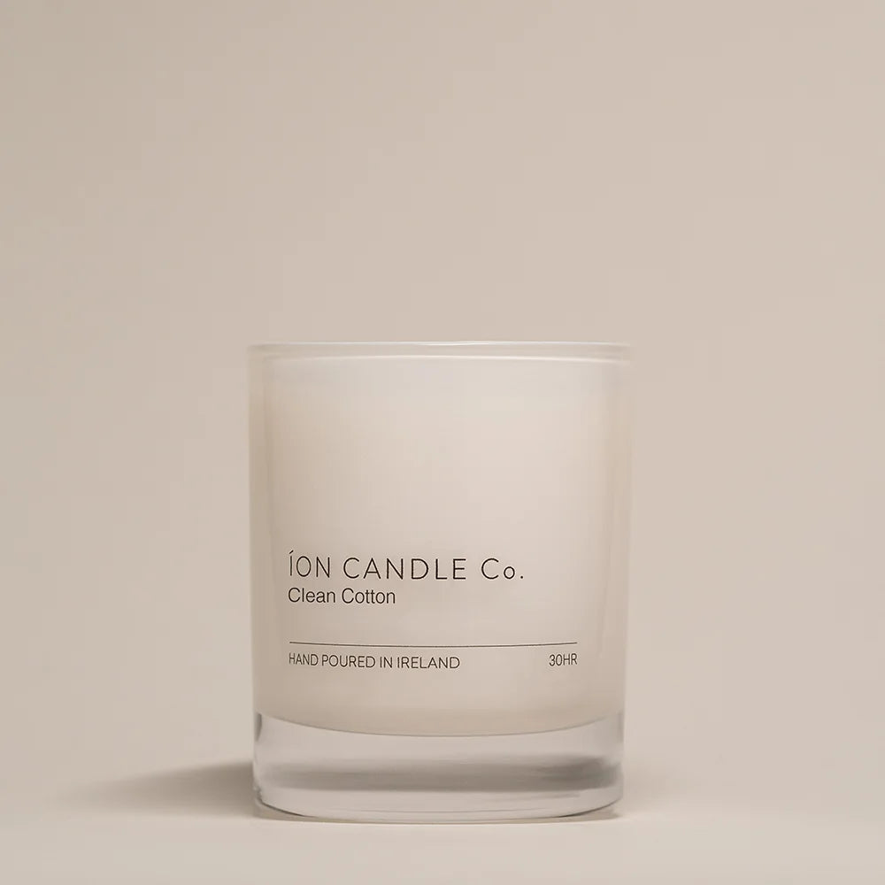 Ion Candle Co. - Clean Cotton Luxury Scented Candle against a beige background. 30 hours burn time