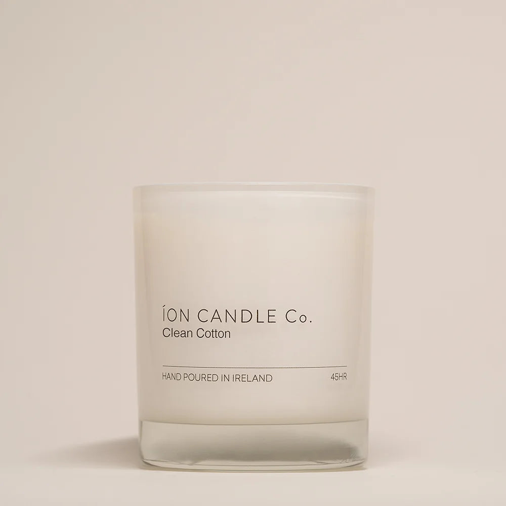 Ion Candle Co. - Clean Cotton Luxury Scented Candle against a beige background. 45 hours burn time