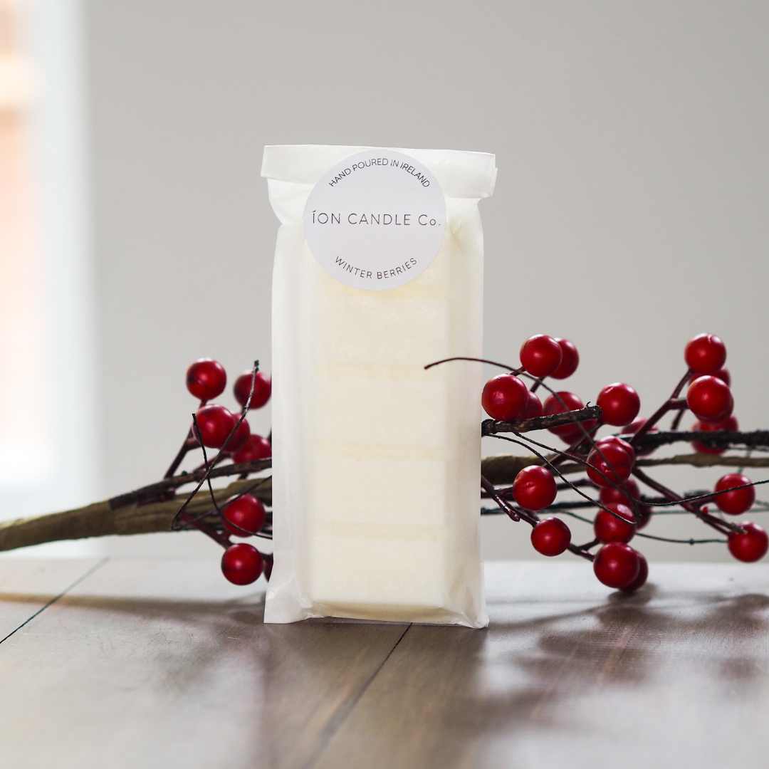 luxury scented winter berries wax melt with a red berries back drop