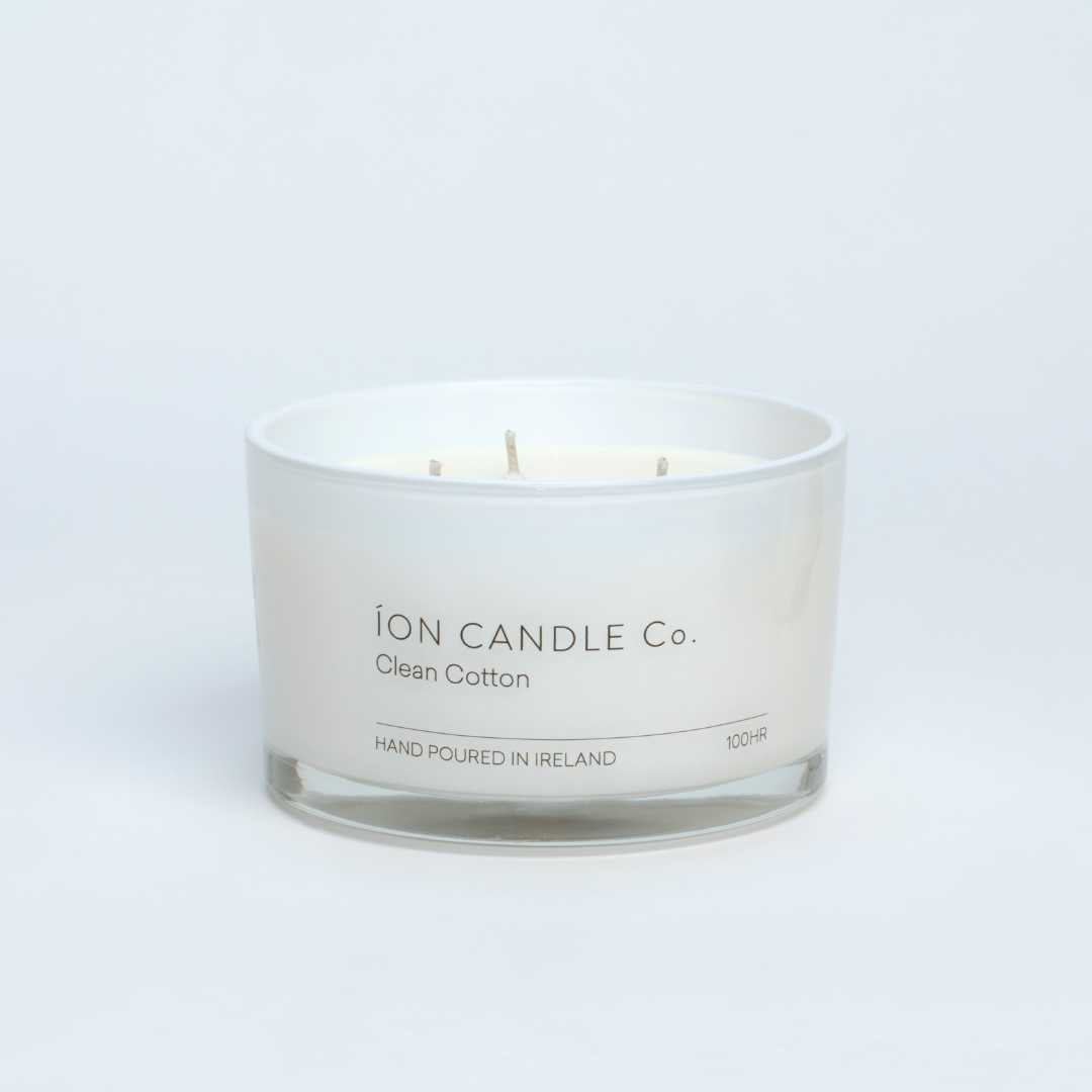 Ion Candle Co. - Clean Cotton Luxury Scented Candle against a beige background. 100 hours burn time