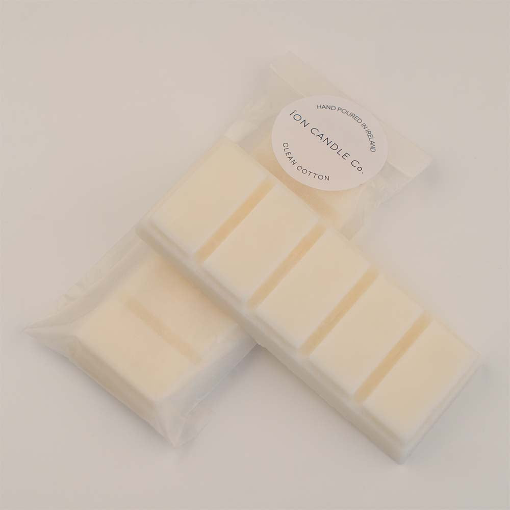 Ion Candle Co. - Luxury scented clean cotton wax melts in their white paper packaging against a white background.