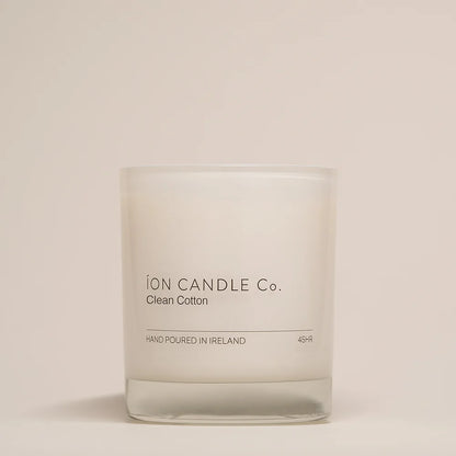 Ion Candle Co. - Clean Cotton Luxury Scented Candle against a beige background. 45 hours burn time