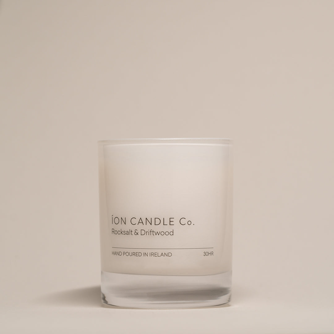 Ion Candle Co. - luxury scented rocksalt & driftwood candle against a beige background - 30 hours burn time