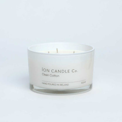 Ion Candle Co. - Clean Cotton Luxury Scented Candle against a beige background. 100 hours burn time