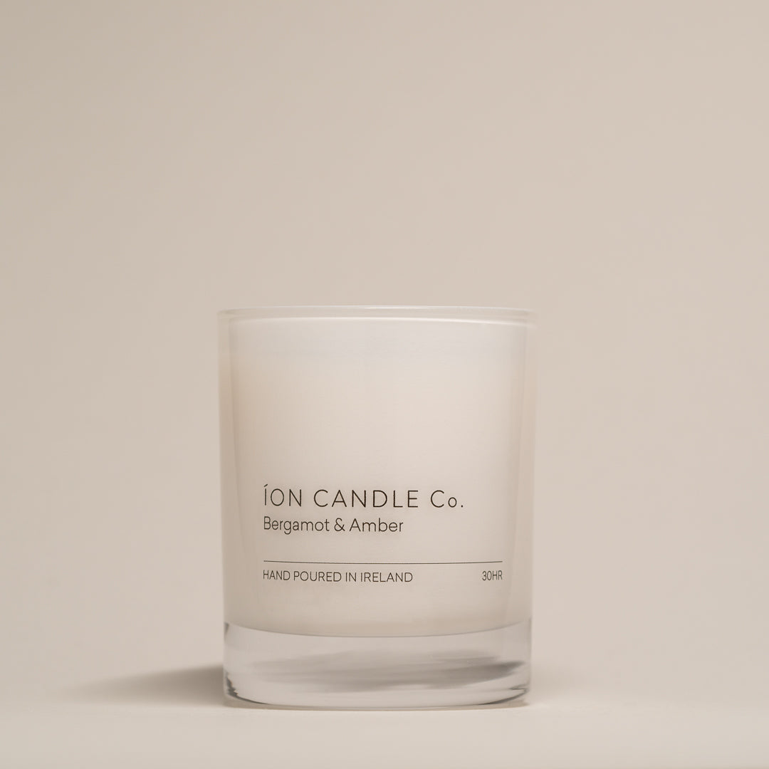 Ion Candle Co. - Bergamot & Amber luxury scented candle against a beige background