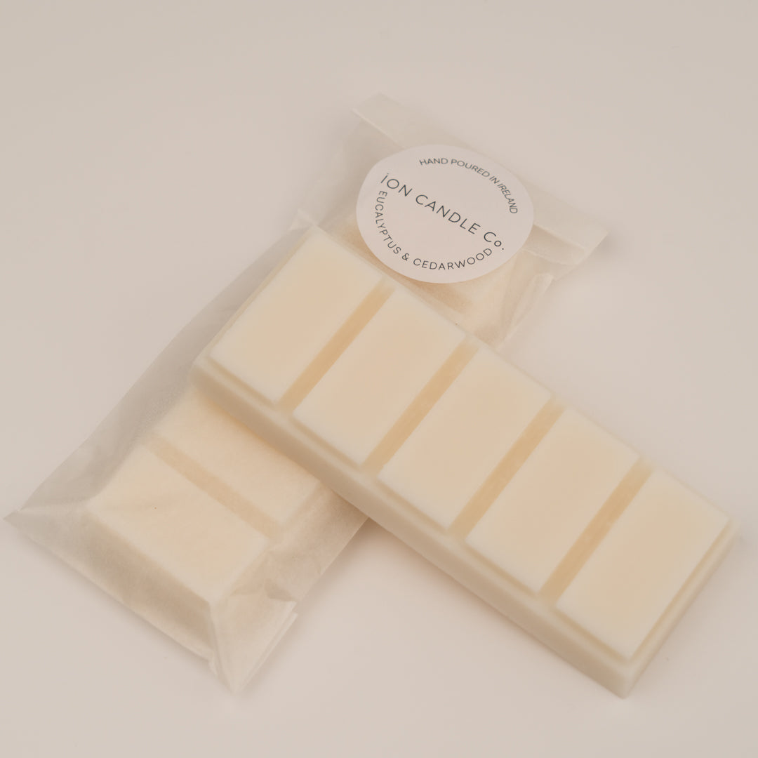 Ion Candle Co. - Eucalyptus and Cederwood Luxury Wax Melts, in their white paper packaging placed on a white background